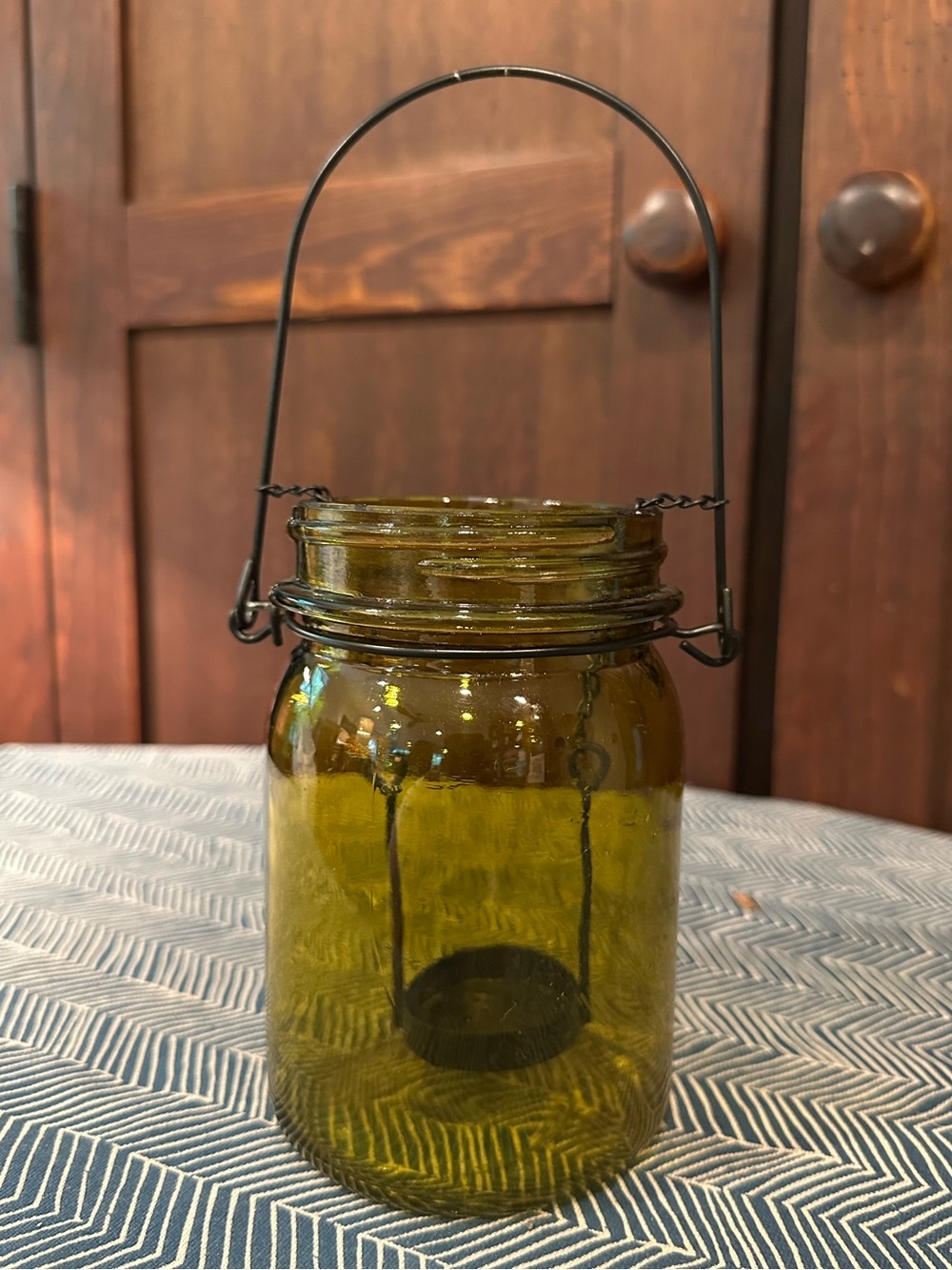 Amber glass tea light holder • candle jar • metal hanger